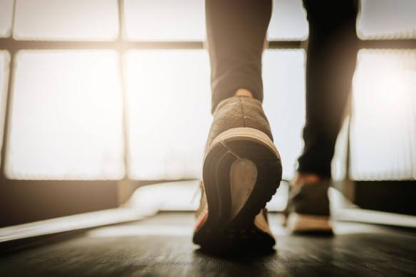 close-up-shot-of-woman-leg-running-on-a-treadmill